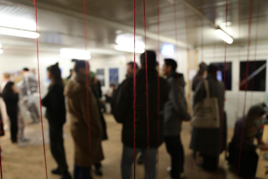 Visitors moving through the installation
