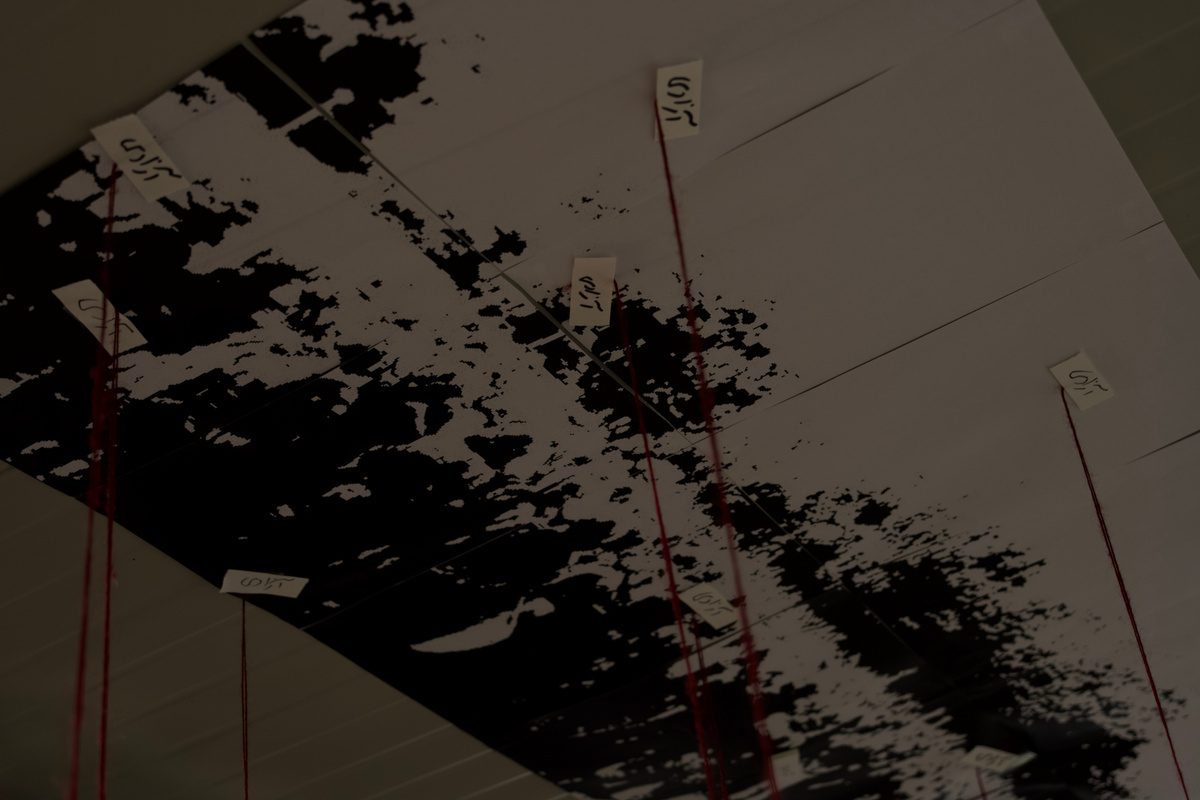 Shadows of figures cast across the floor